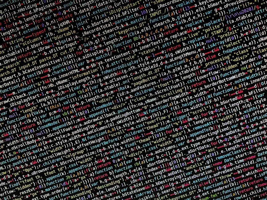 The image displays a close-up view of computer code consisting of a dense array of programming language syntax, including various commands, functions, variables, and operators in multiple colors such 